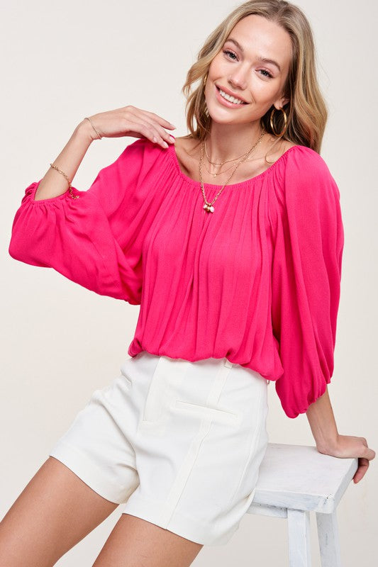 Blusa de primavera con hombros descubiertos y mangas abullonadas