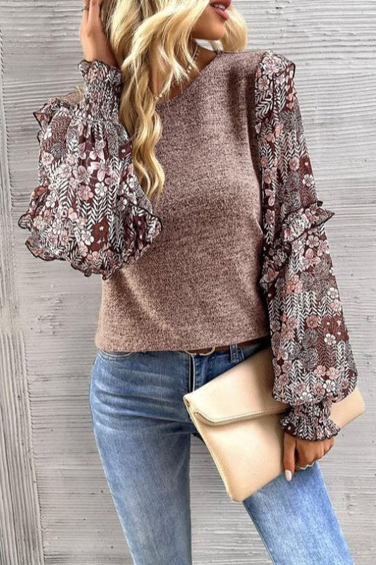 Blusa con mangas abullonadas y volantes florales