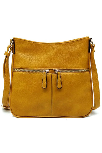 Bolso bandolera con cremallera y borlas en la parte delantera