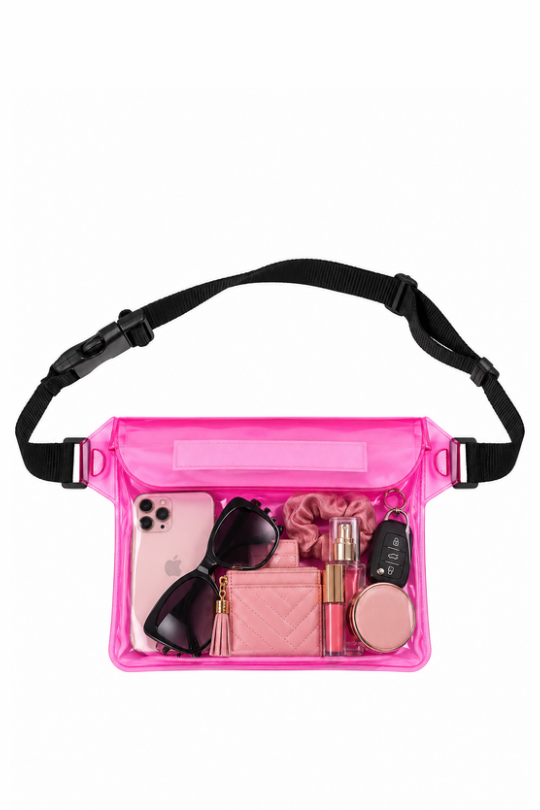 A bright pink transparent waterproof pouch bag with a black adjustable strap, shown filled with various pink and black accessories on a solid white background.