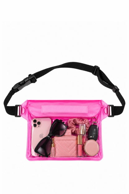 A bright pink transparent waterproof pouch bag with a black adjustable strap, shown filled with various pink and black accessories on a solid white background.